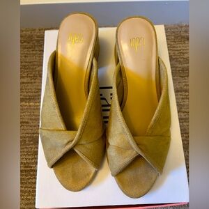 Cabi Marigold Yellow Suede
Slide Mules
$25 
Size: 7
In good condition.